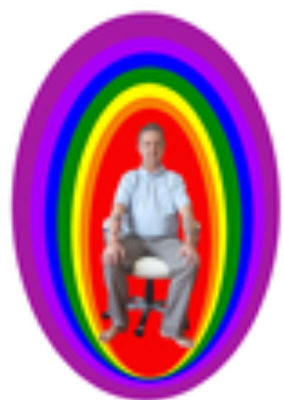 Bruce Clifton sitting inside an egg of many layers and colours